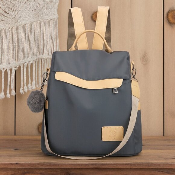ποΈChic & Versatile Travel Pom-Pom Charm Backpack β Waterproof & Stylish πβ¨ - Picture 1 of 11